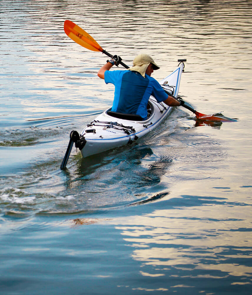 Man kayaks in river