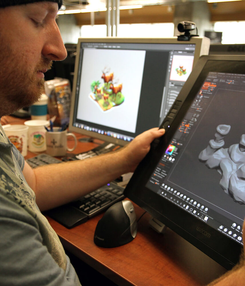 A creative professional designs on his tablet