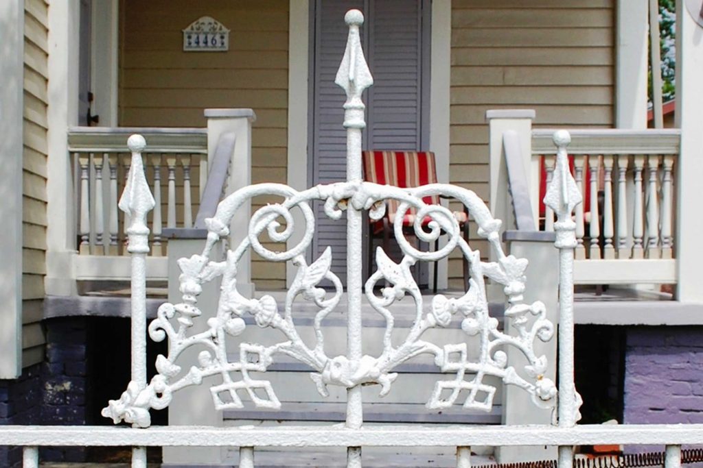 White iron gate outside a home in greater New Orleans, LA